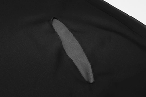 Close-up of the grey patchwork stitching detail on a black sheer chiffon blouse