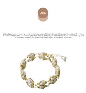 Macro detail of baroque freshwater pearl bracelet with intricate gold wire wrapping design
