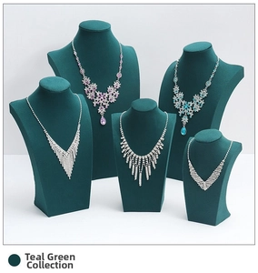 Dark green velvet necklace bust stands in a tiered set for elegant jewelry display