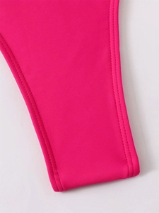 Macro shot of rose red bikini fabric with high-quality double-needle stitching and texture