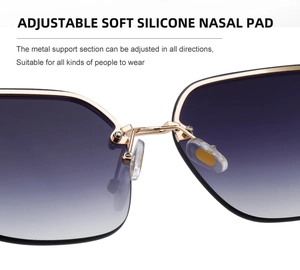 Detailed macro view of adjustable soft silicone nose pads on gold metal sunglasses