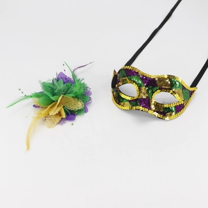 Detail of sequin masquerade mask and matching feather headpiece in purple, green, and gold