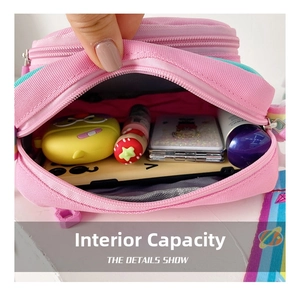 Detail shot of the spacious inner compartments of the pink cartoon unicorn shoulder bag
