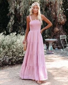 Detail of pink striped smocked bodice and tiered maxi dress for summer beach vacation