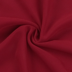 Macro shot of dark red mesh fabric texture showing fine weave and soft drapery folds