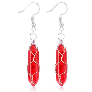Detail of red hexagonal stone earrings with silver wire wrapping and fishhook ear hooks