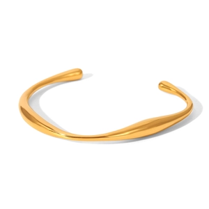Macro shot of 18K gold plated stainless steel bracelet showing fluid organic design