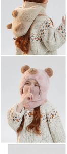 Detail view of plush bear ears and soft knit texture on integrated children winter warm hat
