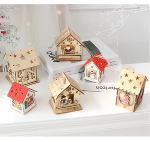 Set of 6 lighted wooden Christmas house ornaments with warm LED glow and festive cutouts