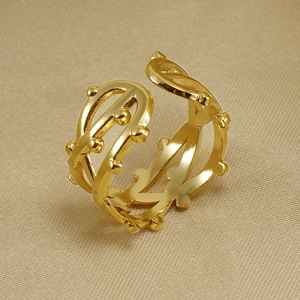 Detail of gold-plated adjustable ring with unique wave texture and bead accents