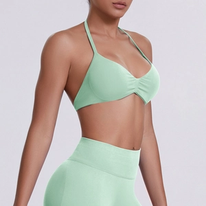 Detail of mint green seamless yoga set showing racerback sports bra and high waist leggings