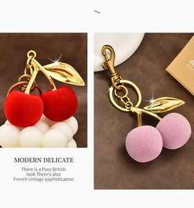 Detail of flocked cherry pendants with gold leaves and textured velvet finish