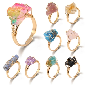 Detail showing nine colorful raw citrine crystals handcrafted in gold wire wrap rings
