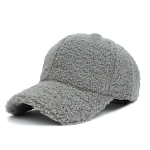 Detail of grey lamb wool baseball cap texture showing soft plush warm fabric
