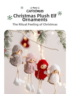 Detail of four colorful plush Christmas elves hanging on tree branches with bokeh lights