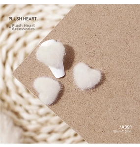 Macro shot of 18mm plush white heart decoration with soft fluffy texture for DIY craft