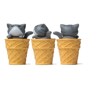 Three grey and white cat figurines in waffle cones from front, side and back views
