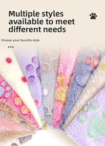 Detail view of colorful coral fleece pet blankets with cute embroidered paw patterns