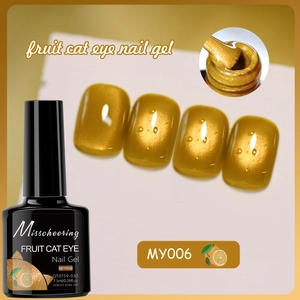 Detail showing amber cat eye nail gel texture with magnetic shimmer and brush head