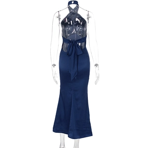 Detail of navy satin halter dress featuring a large bow tie on the backless design