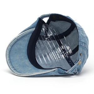 Retro light blue washed denim newsboy flat cap featuring an adjustable metal strap back
