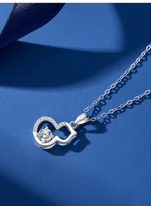 Detailed view of S925 silver gourd pendant featuring shimmering moissanite and claw setting