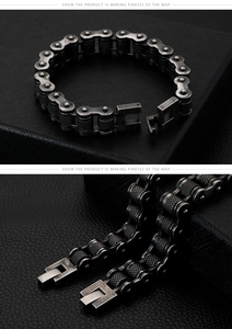 Detail of vintage industrial bike chain bracelet with knurled texture and press buckle
