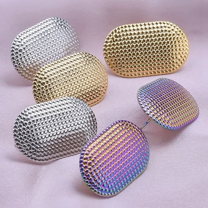 Detail of 304 stainless steel oval earrings with honeycomb texture in gold, silver and rainbow