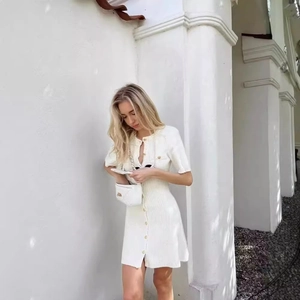 Elegant white knit mini dress with short sleeves and front buttons for women