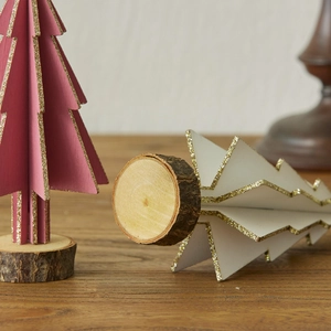 Mini wooden Christmas trees in pink and white with gold glitter and natural wood base