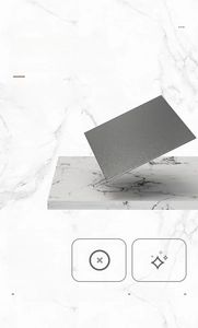 Detail view of gun-grey wall-mounted tissue box with matte texture on marble background