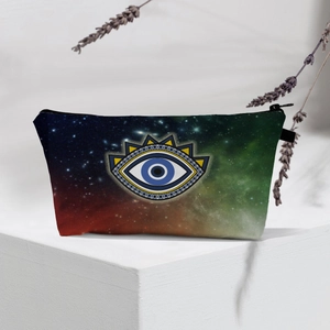 Detail of waterproof makeup bag with colorful galaxy nebula print and evil eye charm