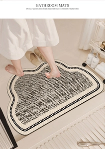 Absorbent diatomaceous mud bathroom mat with black geometric pattern used in shower area