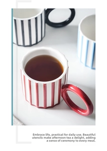 Top view of ceramic mugs with large round handles and textured vertical stripes