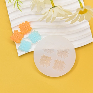 Silicone waffle mold with four cavities on a yellow background with finished miniatures