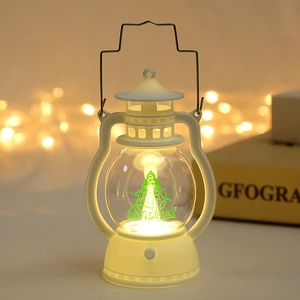 Ivory Christmas LED lantern with Merry Christmas tree motif and warm ambient lighting