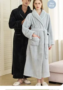 Detailed view of plush coral fleece robes in sky blue and black with tied waist belts