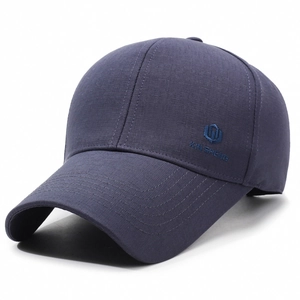 Navy blue baseball cap with shield embroidery and XIN SHENG logo from 45-degree angle