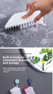 Close-up of flexible cleaning brush with ergonomic handle and wall-mounted storage hook