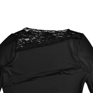 Detail view of the lace patchwork shoulder and stitching on this black long sleeve slim top