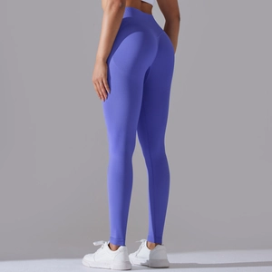 Macro view showing the seamless knitted texture and push-up effect of royal blue yoga pants
