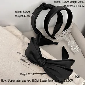 Elegant black satin headband set featuring large bow and wide fabric hair accessories
