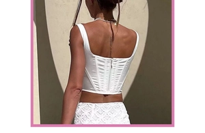Detailed back view of white satin corset top showing ribbing and zipper closure
