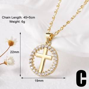 Detail view of a 22mm gold-plated cross pendant featuring a zircon-encrusted outer circle