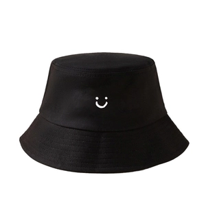 Fashionable black fisherman hat with a white smiley face print for sun protection