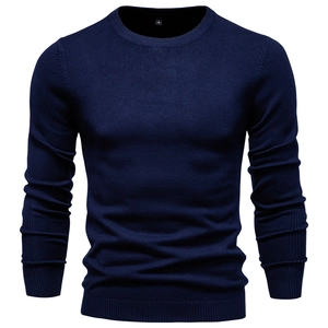 Close-up of navy blue crew neck sweater showing premium knitted fabric texture and collar