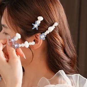 Barrette coquillage asymétrique avec strass bleus et perles pour un look de vacances