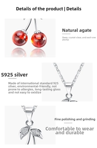 Macro detail of S925 sterling silver cherry pendant with red agate and textured leaf