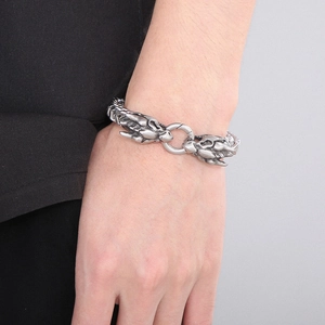 Detailed close-up of a men's vintage silver dragon head chain bracelet in matte steel
