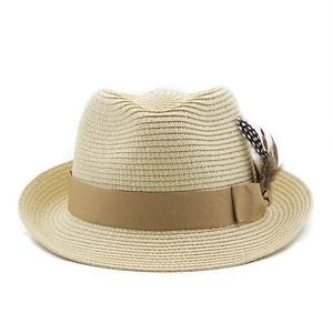 Detail of classic straw fedora with dark brown ribbon and speckled feather accent